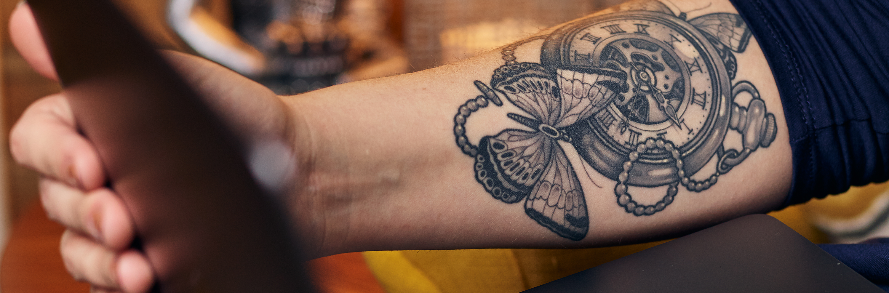 Creative agency - Clockwork tattoo on arm