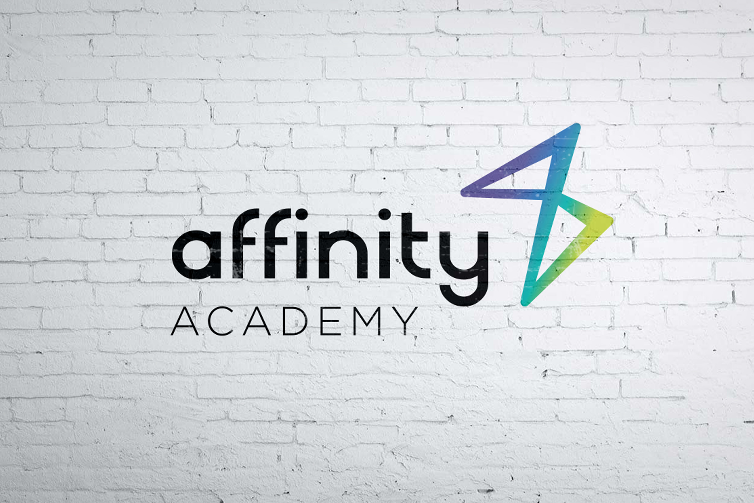 Affinity Academy new brand identity design - logo on white wall